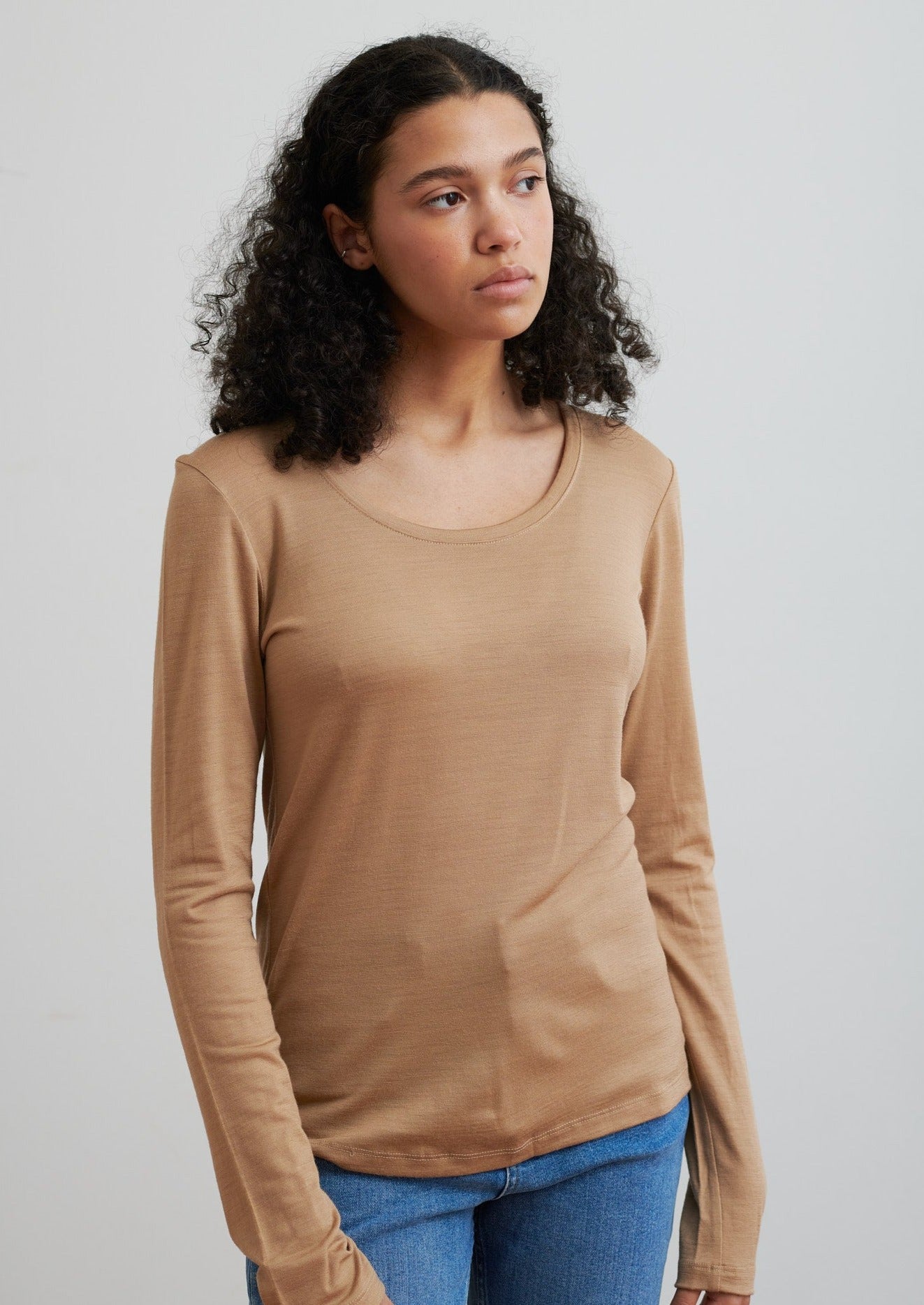 Detailed with a scoop neckline, this layering essential in merino is soft and breathable to wear all seasons. Made from certified ethical wool from New Zealand farms.