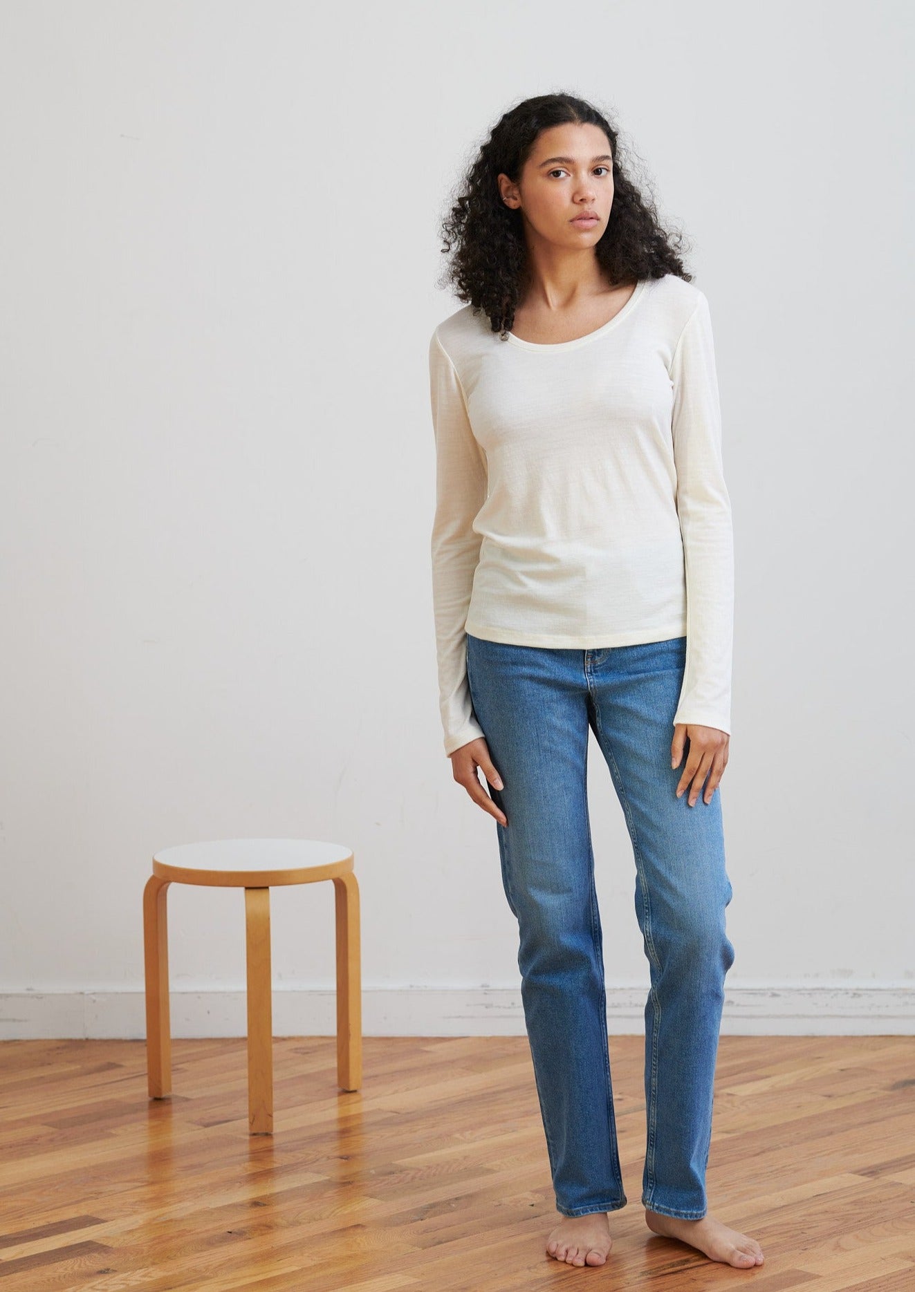 Detailed with a scoop neckline, this layering essential is soft and breathable to wear all seasons.