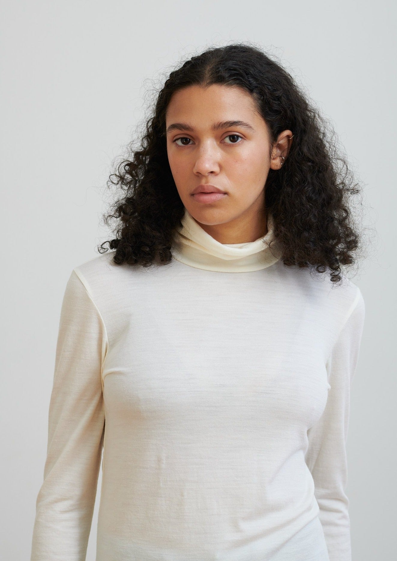 A timeless turtleneck, this layering essential in ethical wool is soft and breathable to wear all seasons.