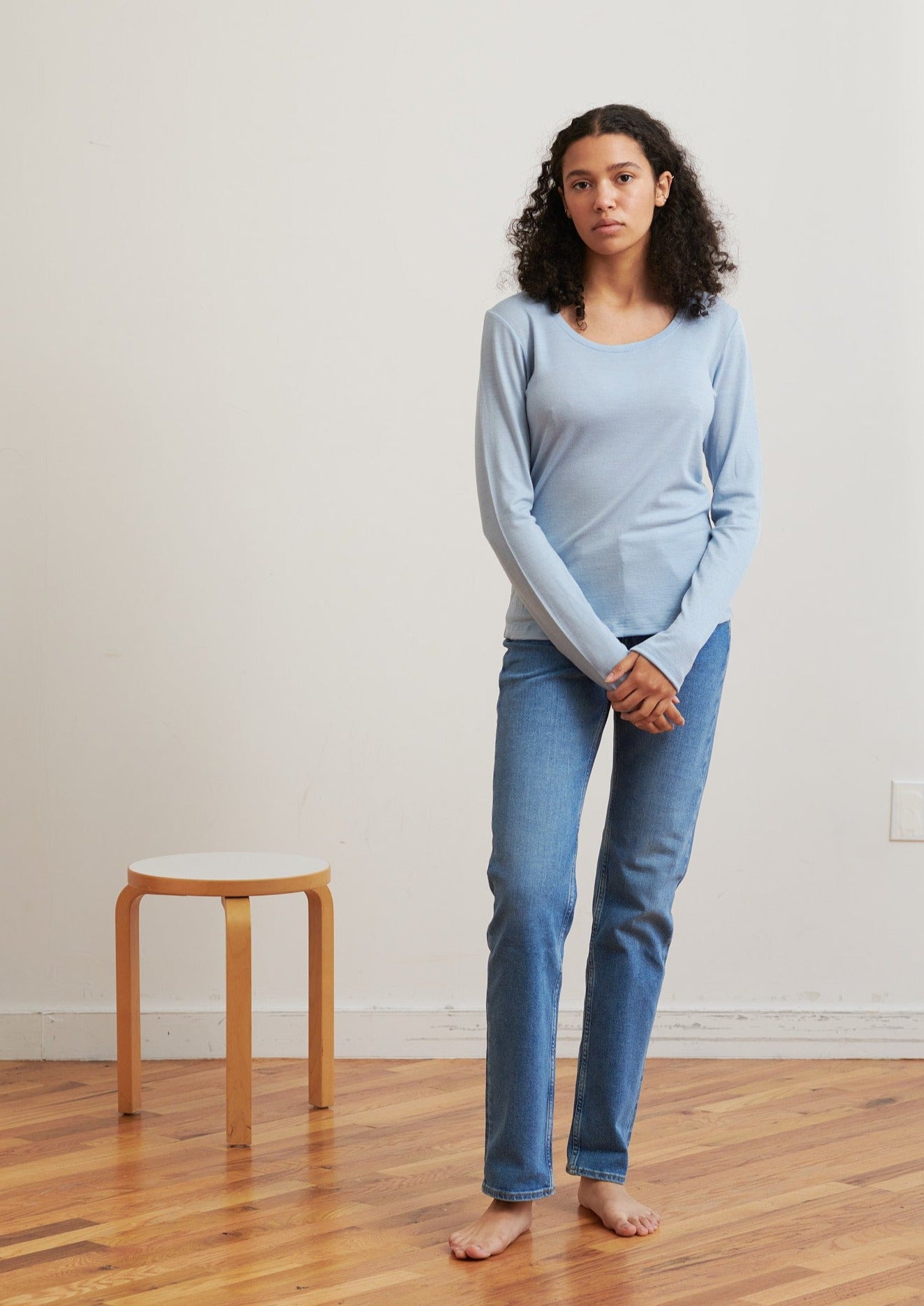 Detailed with a scoop neckline, this layering essential is soft and breathable to wear all seasons.