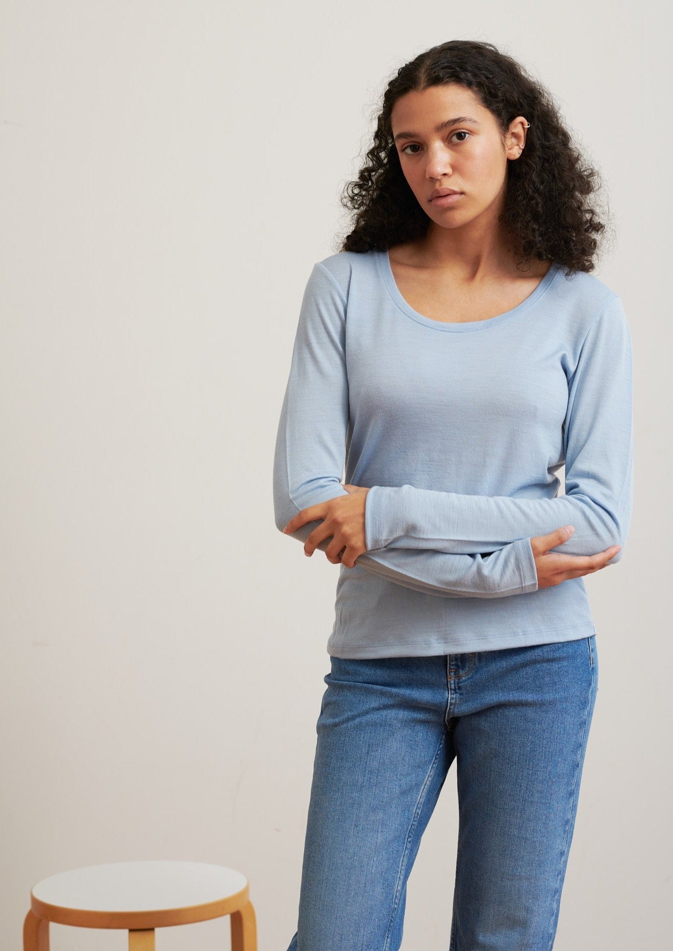 Detailed with a scoop neckline, this layering essential is soft and breathable to wear all seasons.