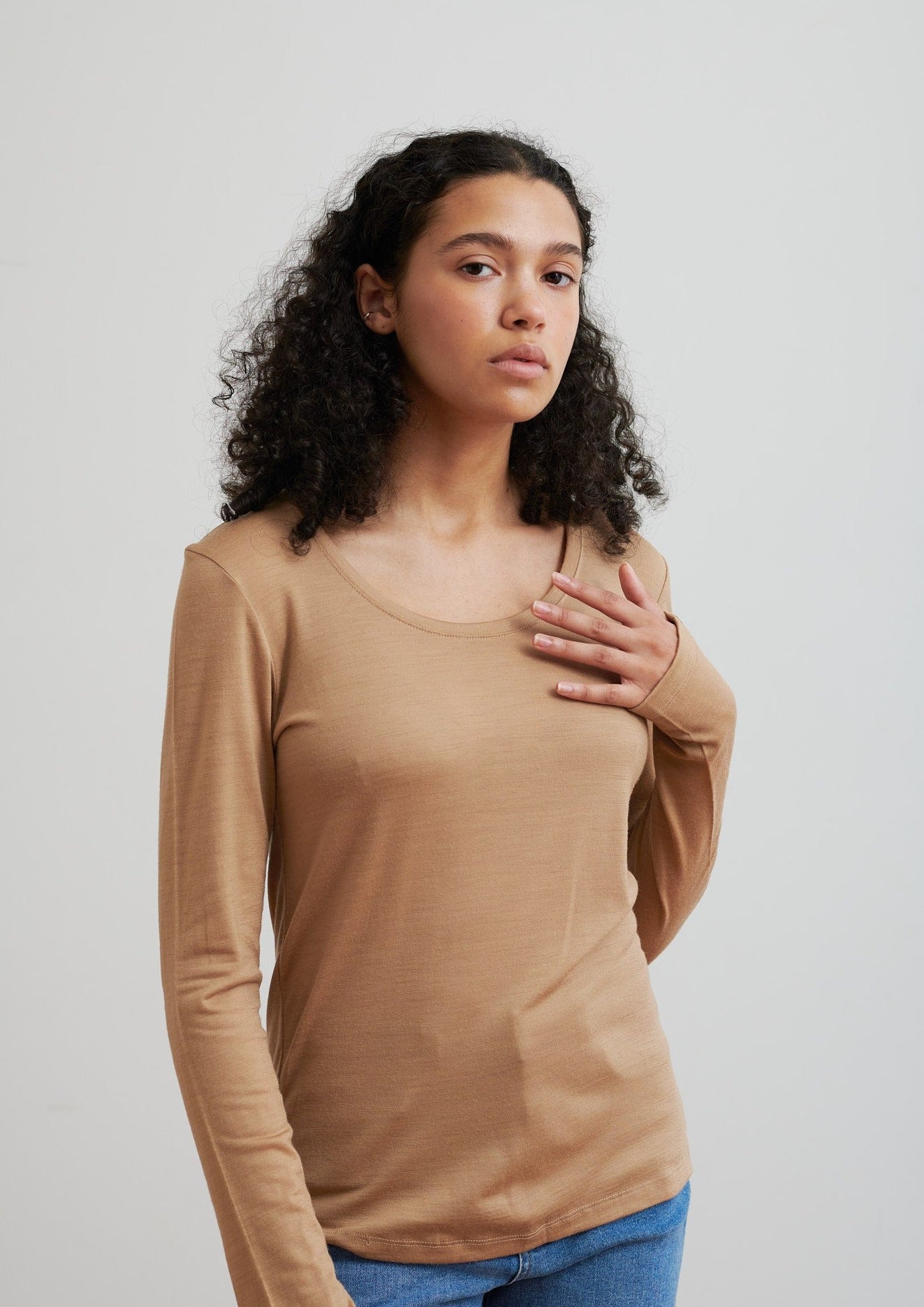 Detailed with a scoop neckline, this layering essential in merino is soft and breathable to wear all seasons. Made from certified ethical wool from New Zealand farms.
