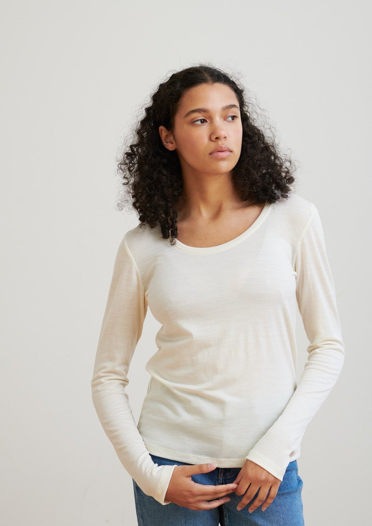 Detailed with a scoop neckline, this layering essential is soft and lightweight to wear all seasons. 